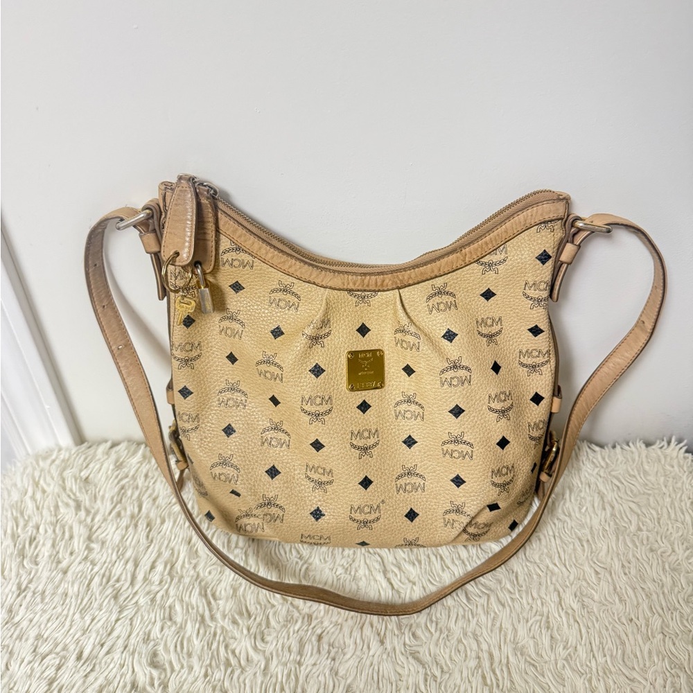 MCM Tan Monogram Sling bag with lock and key